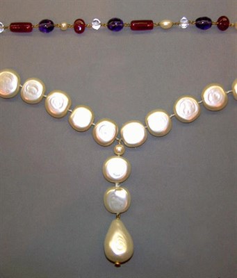 Lot 215 - Two Chanel Necklaces Comprising a russet red,...
