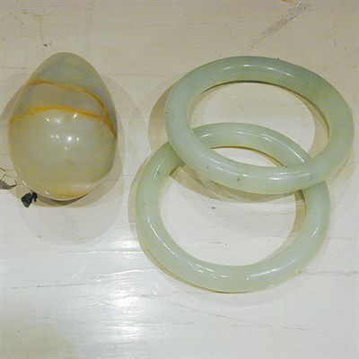 Lot 176 - Pair of Hardstone Bangles and an Onyx Egg