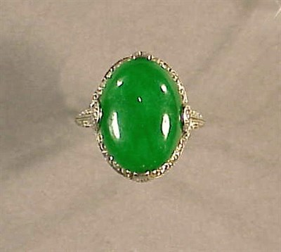 Lot 556A - Chinese Jade Cabochon and Diamond Ring...