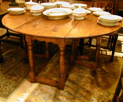 Lot 129 - Provincial Georgian Style Oak Gate-Leg Table
