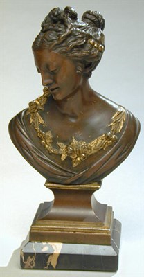 Lot 595 - Bronze Bust of a Lady With braided hair and a...