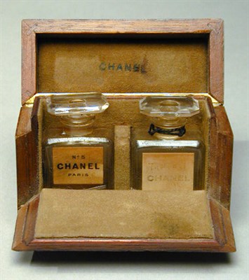 Lot 102 - Chanel No. 5 Two small flacons in a burl-wood...