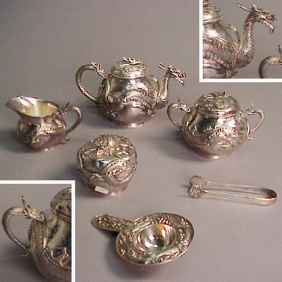 Lot 319 - Chinese Silver Tea Set Comprising a teapot,...