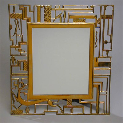 Lot 245 - Hagenauer Brass Mirror The sides pierced with...