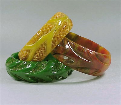 Lot 361 - Group of Three Bakelite Bracelets Each with...