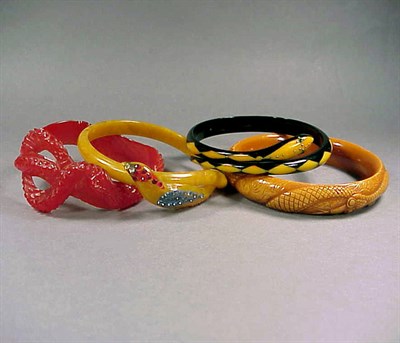 Lot 607 - Group of Four Bakelite and Celluloid Bracelets...