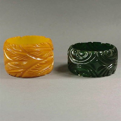 Lot 609 - Two Bakelite Bracelets Each with carved...