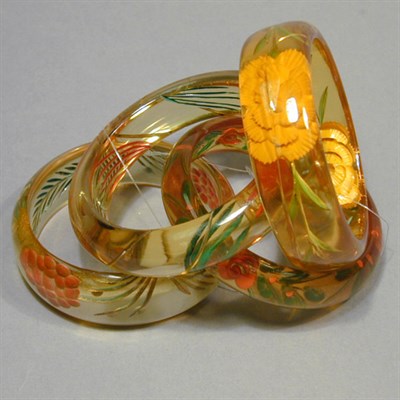 Lot 352 - Group of Four Bakelite Reverse Carved and...