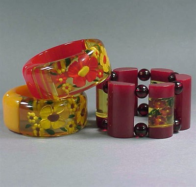 Lot 489 - Group of Three Bakelite Reverse Carved and...