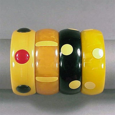 Lot 476 - Group of Four Bakelite Dot Bracelets Each of...