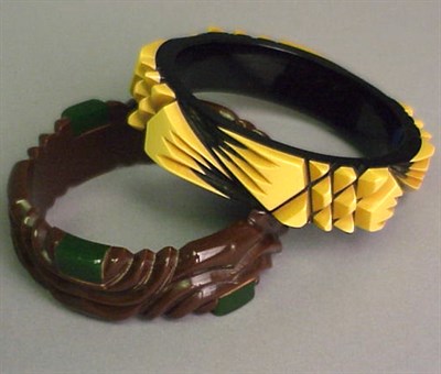 Lot 302 - Two Bakelite Two-Tone Bakelite Bracelets Each...