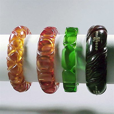 Lot 482 - Group of Four Bakelite Bracelets Each...