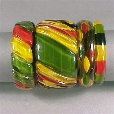 Lot 319 - Group of Four Bakelite Reverse Carved and...