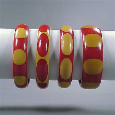 Lot 365 - Group of Four Bakelite Dot Bracelets Each in...