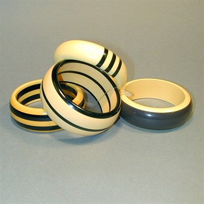 Lot 303 - Group of Four Bakelite Two-Color Bracelets...