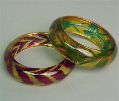 Lot 318 - Two Bakelite Reverse Carved and Painted...