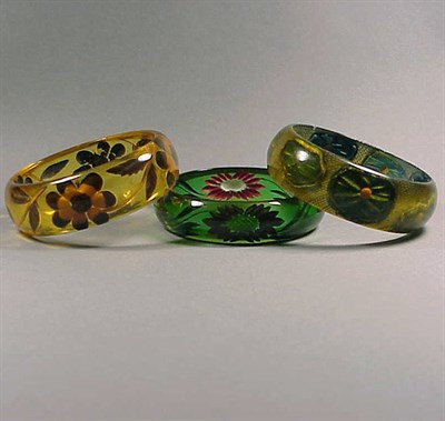 Lot 475 - Group of Three Bakelite Reverse Carved and...