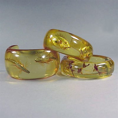 Lot 375 - Group of Three Bakelite Reverse Carved and...