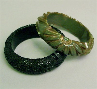 Lot 382 - Two Bakelite Bracelets Each in green or black...