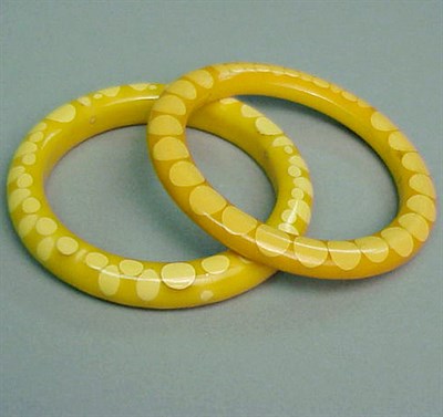 Lot 364 - Two Bakelite Random Dot Bracelets Each in...