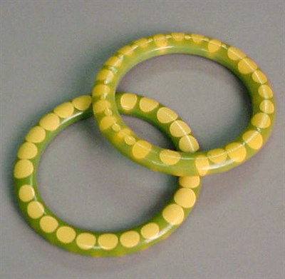 Lot 314 - Two Bakelite Bow Tie Bracelets Each in green...