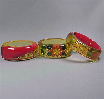 Lot 494 - Group of Three Bakelite Reverse Carved and...