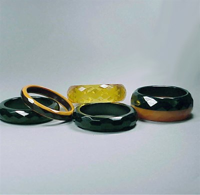 Lot 574 - Group of Five Bakelite Faceted Bracelets Each...