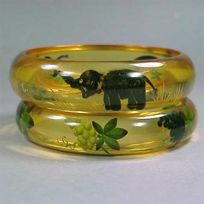Lot 650 - Two Bakelite Reverse Carved and Painted...