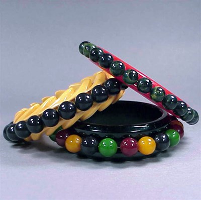 Lot 571 - Group of Three Bakelite Bracelets Each with...