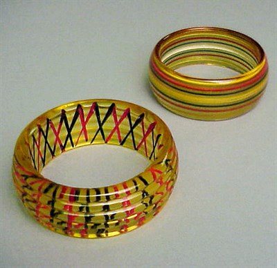 Lot 397 - Two Bakelite Reverse Carved and Painted...