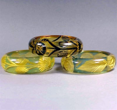 Lot 398 - Group of Three Bakelite Reverse Carved and...
