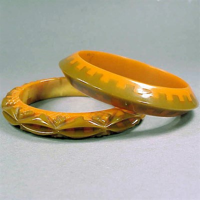 Lot 269 - Two Bakelite Two-Color Laminate Bracelets Each...