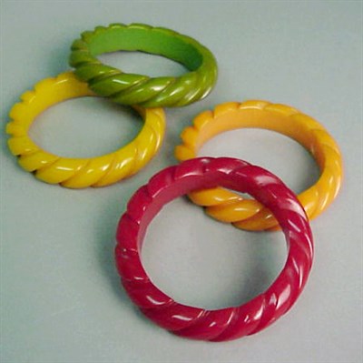 Lot 400 - Set of Four Bakelite Bracelets Each in various...