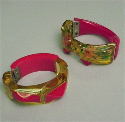 Lot 373 - Two Bakelite Two-Color Hinged Bracelets One...