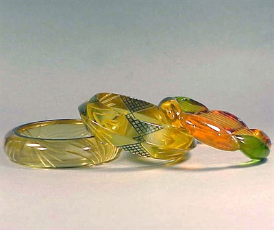 Lot 660 - Group of Three Bakelite Reverse Carved and...