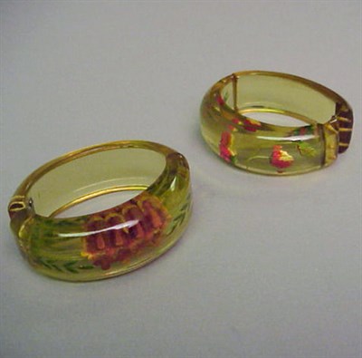 Lot 374 - Two Bakelite Reverse Carved and Painted...