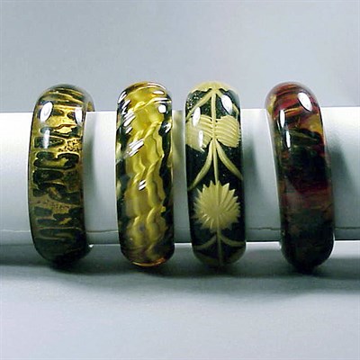 Lot 322 - Group of Three Bakelite Reverse Carved and...