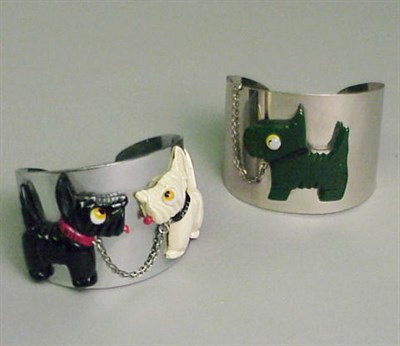 Lot 585 - Two Bakelite, Celluloid and Metal Cuffs Each...