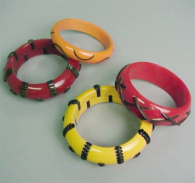 Lot 599 - Pair of Bakelite Bracelets Each with raised...