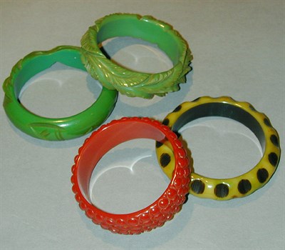 Lot 644 - Group of Four Bakelite Bracelets Each of...