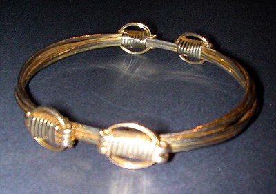 Lot 76 - Gold Elephant Hair Style Adjustable Bracelet...