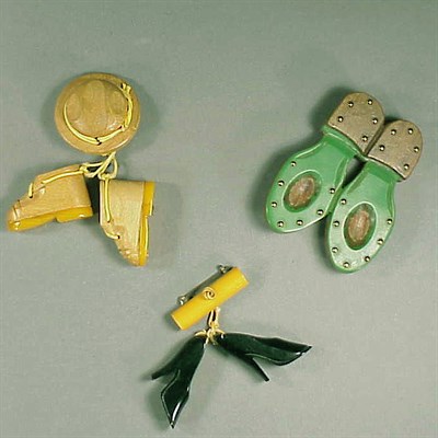 Lot 291 - Group of Three Bakelite Brooches Each...