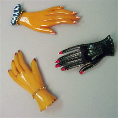 Lot 593 - Group of Three Bakelite Hand-Form Brooches...