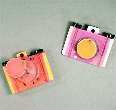 Lot 594 - Pair of Bakelite and Lucite Brooches Each...
