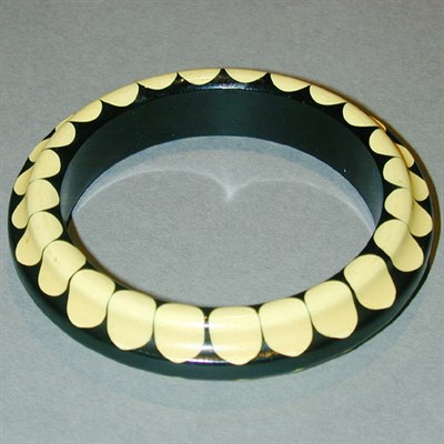 Lot 317 - Bakelite Bow Tie Bracelet In cream and black....