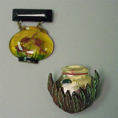 Lot 311 - Two Bakelite and Wood Reverse Carved and...