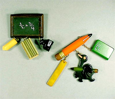 Lot 381 - Two Bakelite Brooches Each suspending various...