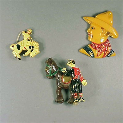Lot 591 - Two Bakelite Brooches One depicting a man on...