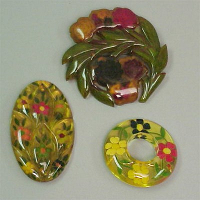 Lot 419 - Group of Three Bakelite Reverse Carved and...