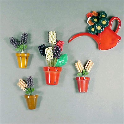 Lot 424 - Group of Four Bakelite and Celluloid Brooches...